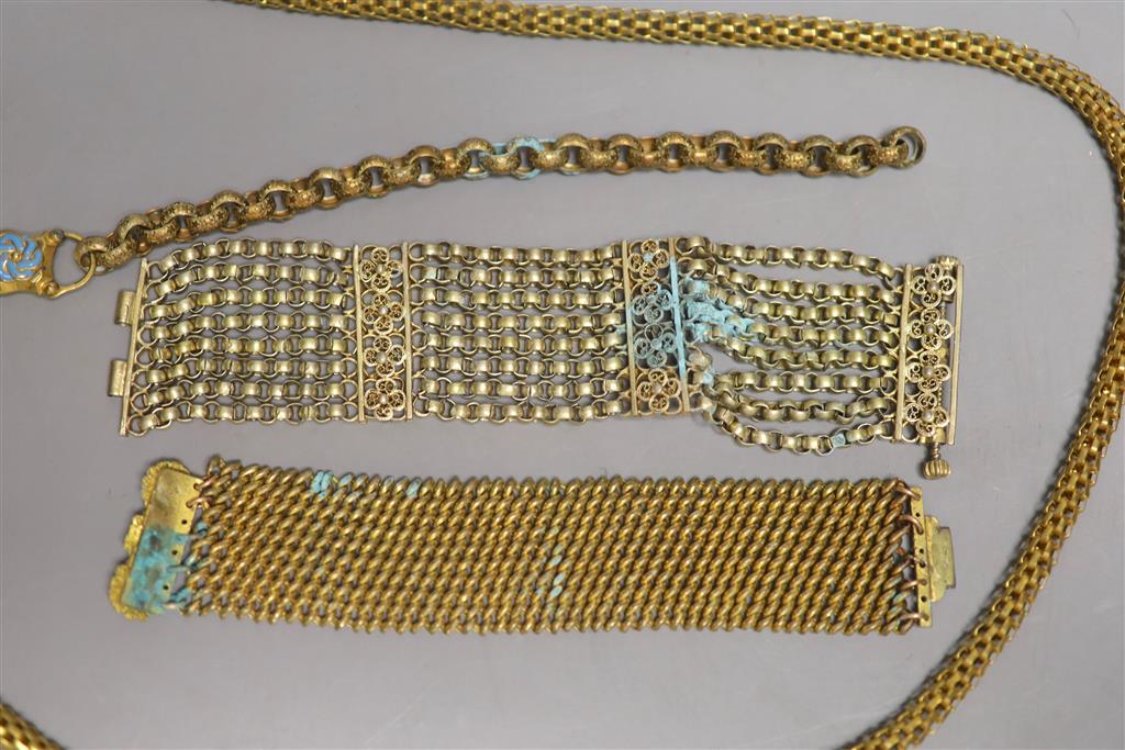 Four items of Victorian pinchbeck jewellery including a serpent necklace, 92cm and three assorted bracelets.